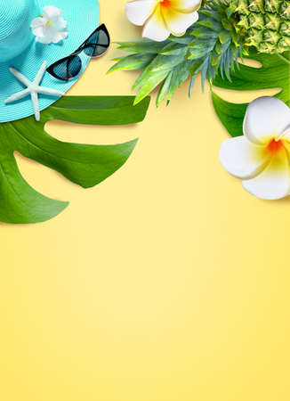 Summer background design concept. Top view with starfish, pineapple, hat, sunglasses flower plumeria and monstera leaves on yellow background.の写真素材