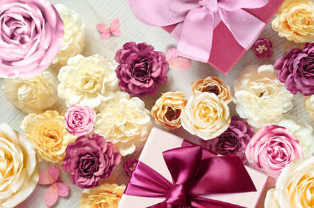 Colorful roses and gift box on white background. Beautiful, good for holidays and gift. flowers pattern.の写真素材