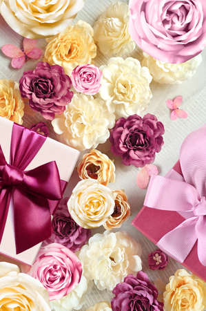 Colorful roses and gift box on white background. Beautiful, good for holidays and gift. flowers pattern.の写真素材