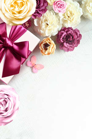Colorful roses and gift box on white background. Beautiful, good for holidays and gift. flowers pattern.の写真素材
