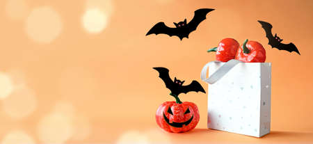 Halloween pumpkins, bats and shopping bag. Happy halloween concept.の写真素材