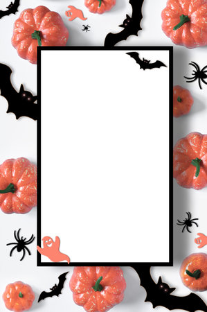 Happy Halloween holiday flat lay composition with pumpkins, spiders, bats on white background. Halloween banner mockup, greeting card designの写真素材