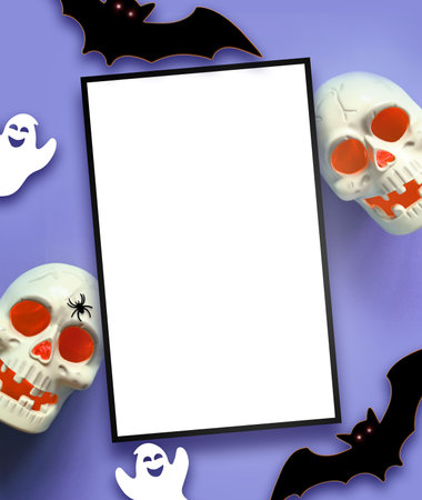 Halloween decorations on purple background. Happy Halloween concept. Flat lay pumpkins, scull, bats, ghosts and spidersの写真素材