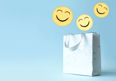 Paper shopping bag with smile face icon.の写真素材