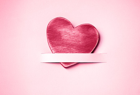 Wooden red heart on a pink background with copy space. Valentine's day concept. Viva magenta color,の写真素材