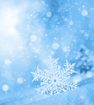 Snowflake shaped bokeh. Combined with blue background. Christmas concept.の写真素材