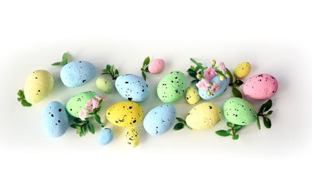 Collection of stylish colors eggs with flowers for Easter celebration on white background. Holiday concept.の写真素材