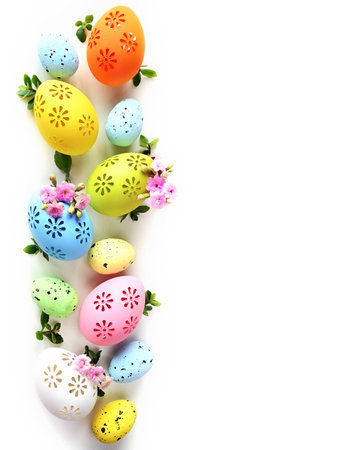 Collection of stylish colors eggs with flowers for Easter celebration on white background. Holiday concept.の写真素材