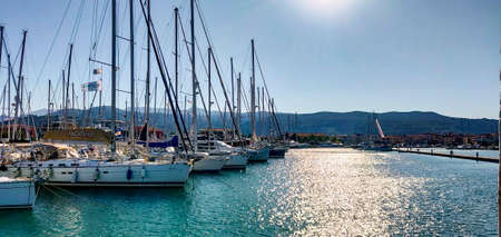 Yachts on the dock in a small marina in greeceの写真素材