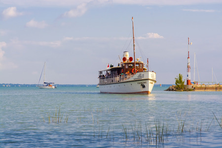 BALATONKENESE, HUNGARY - JULY 27. 2014. - A cruise ship sis leaveing Marina Port in Lake Balaton, Hungaryのeditorial素材