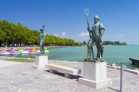 The Fisherman and the Ferryman statues at port of Balatonfured, Hungaryの写真素材