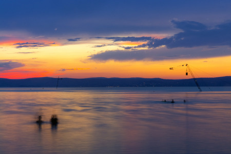 Sunset over Lake Balaton at the Golden Beach of Siofok, Hungaryの写真素材