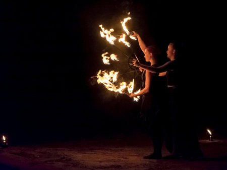 Fire juggers in the dark