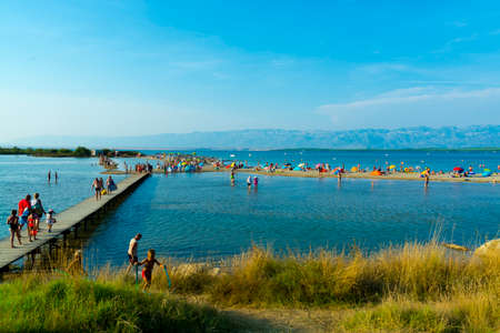 NIN, CROATIA - AUGUST 08, 2018: beach of Nin with touristsのeditorial素材