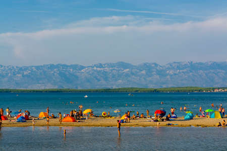NIN, CROATIA - AUGUST 08, 2018: beach of Nin with touristsのeditorial素材