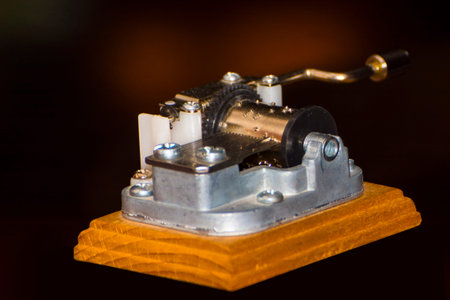 Details of a miniature music playing hurdy-gurdy