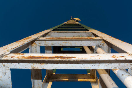 Iron frame of a column with evening sky at Lake Balaton