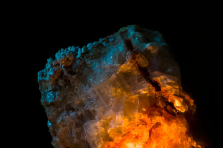 Mineral rock with weak light in the darkの写真素材