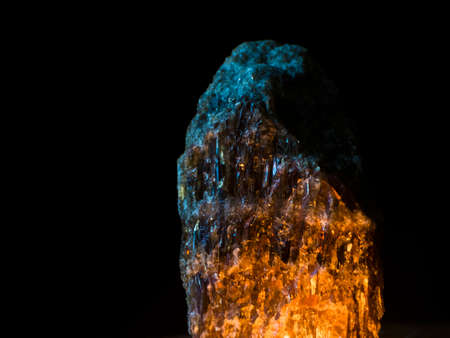 Mineral rock with weak light in the darkの写真素材