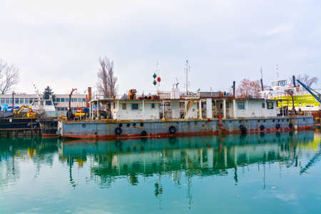Old and rusty ship in the harbor of Siofok in the lake Balatonの写真素材