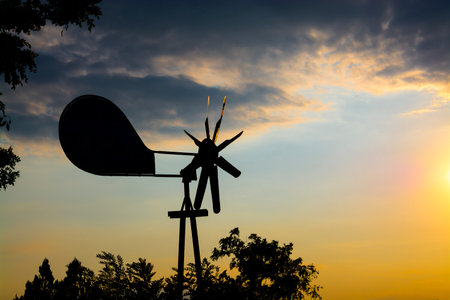 Tin pinwheel at late afternoon in windy weatherの写真素材