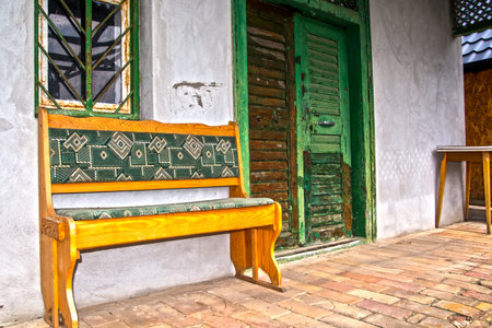 Wooden bench in front of the vineyard houseの写真素材