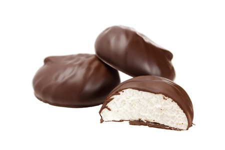 Zephyr covered with chocolate isolated on whiteの写真素材