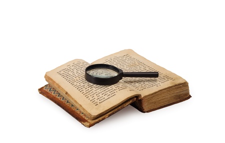 Book and magnifying glass on whiteの写真素材