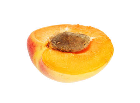 half of apricot isolated on whiteの写真素材