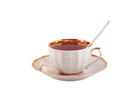 Cup of black tea on a saucer isolated on whiteの写真素材
