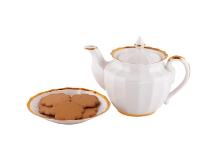 cookies and teapot isolated on whiteの写真素材