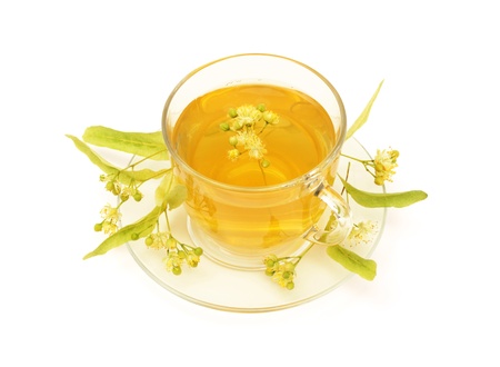 Linden tea in glass cup isolated on  whiteの写真素材