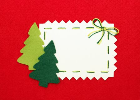 Christmas postcard: empty  blank and  new year trees on red backgroundの写真素材