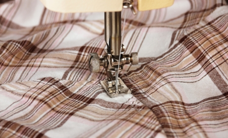 Sewing machine working part with clothの写真素材