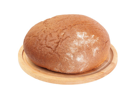 loaf of rye bread on wooden board isolated on white
