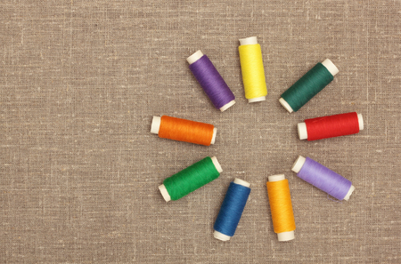 Sewing concept  Colorful  bobbin thread on sacking の写真素材