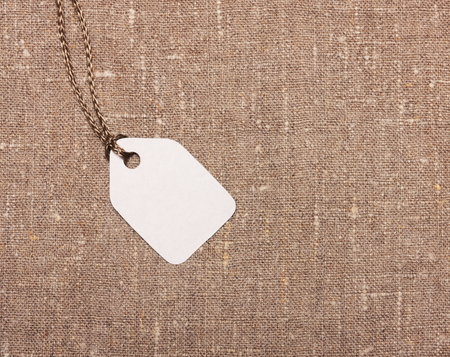 Blank paper label tag on sackclothの写真素材