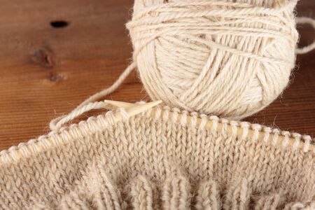 bamboo knitting needles in process of knittingの写真素材