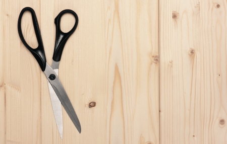 scissors on a wooden backgroundの写真素材