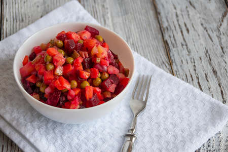 russian salad vinaigrette of beets, potatoes, carrots, onion and pickles with olive oilの写真素材