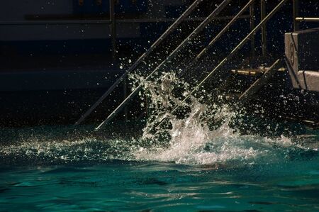Summer in the city swimming pool water splashの写真素材
