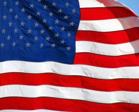 The United States of America flag blowing in the wind.