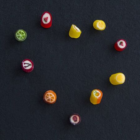 Different color candies on the black backgroundの写真素材
