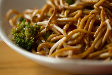Plate with chinese noodles with broccoli makro view
