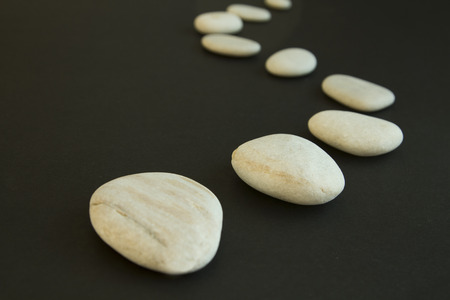 The way from boulder stones on the black backgroundの写真素材