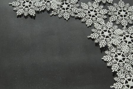 White snowflakes on the black backgroundの写真素材