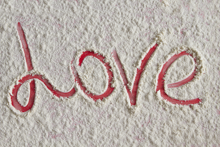 Word love written on the flour background の写真素材