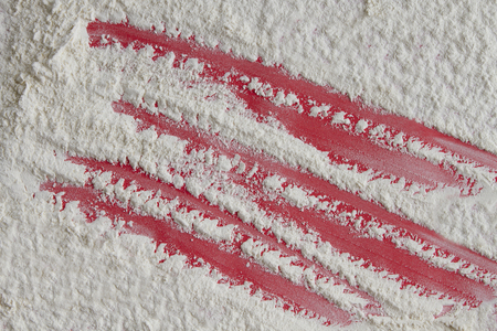 Flour removed from the red background with copy spaceの写真素材