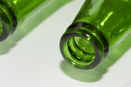 Empty green beer bottles on white backgroundの写真素材