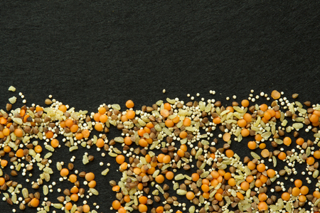 Background from four different groats  on black の写真素材